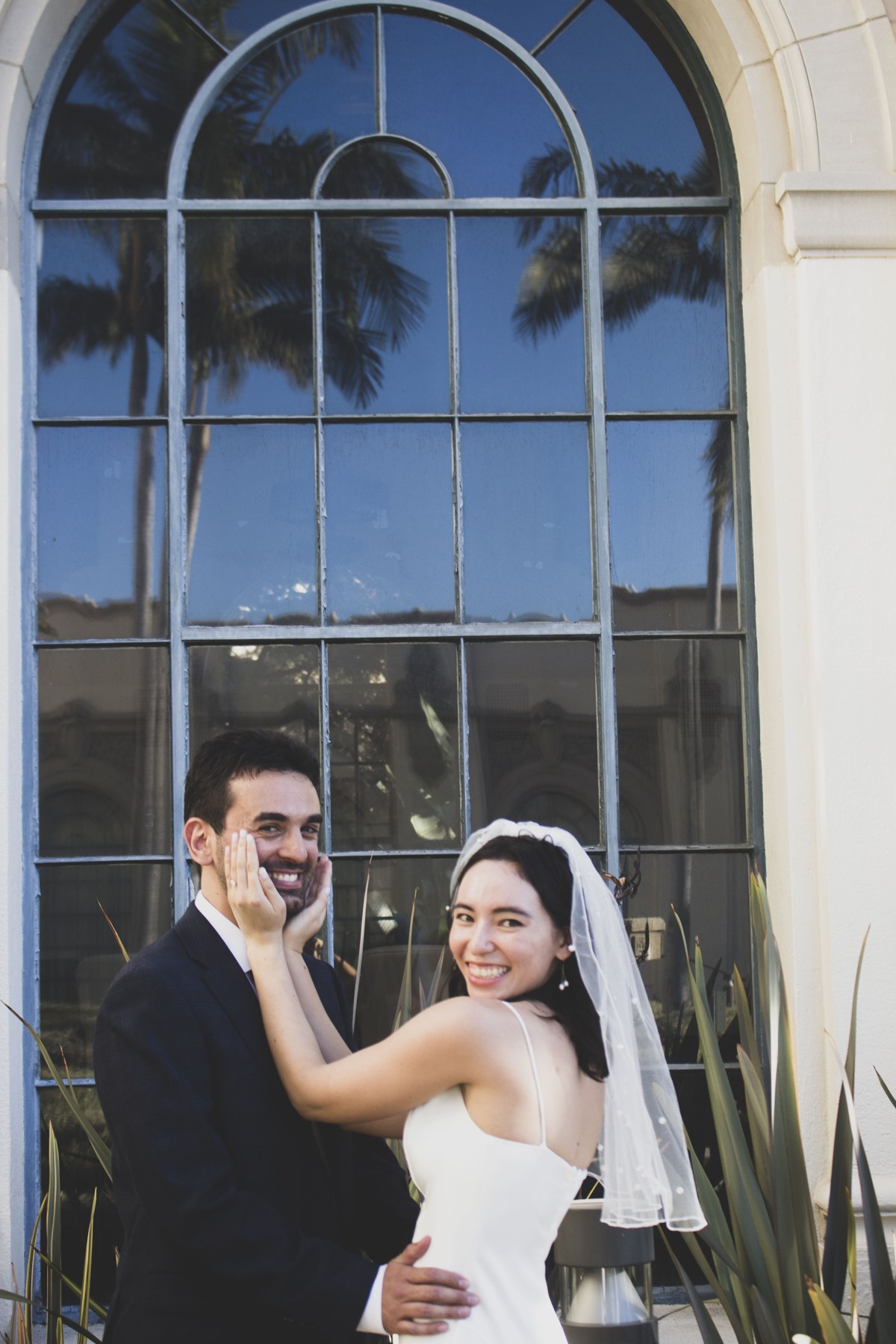 Formosa and Francesco smiling together on their wedding day